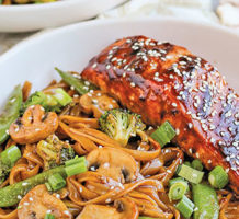 Asian salmon with veggies and noodles